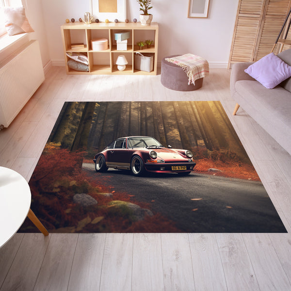 Red Car on a Road in a Forest